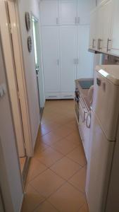Kuchyň nebo kuchyňský kout v ubytování Candy apartman Siófok