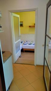 Postel nebo postele na pokoji v ubytování Candy apartman Siófok