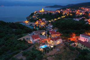 an aerial view of a small town at night at Villa Pinia in Vrbnik