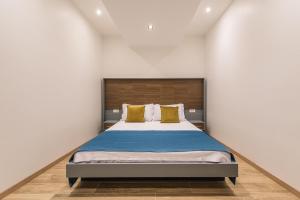 Voodi või voodid majutusasutuse Atelier toas