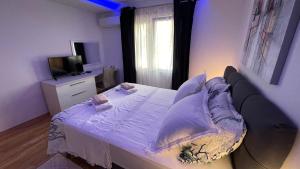 Postel nebo postele na pokoji v ubytování Luxury APARTMAN BILI
