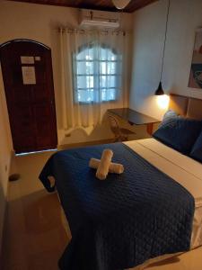 Cama ou camas em um quarto em Pousada Schueng