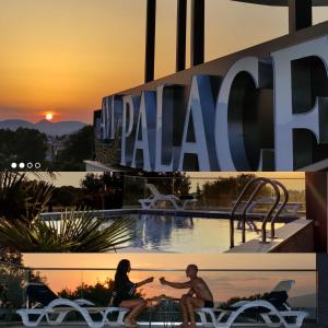 a man and woman sitting at a table in front of a hotel at AM Palace in Ulcinj