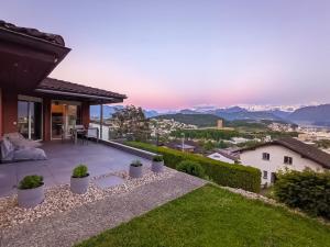 a villa with a view of the mountains at Young Backpackers Homestay in Luzern