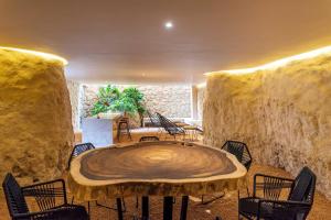 a room with a large wooden table and chairs at Sessile Tulum by The Spot Rentals in Tulum