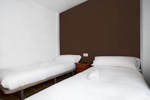 Krevet ili kreveti u jedinici u okviru objekta Residencia Universitaria San José