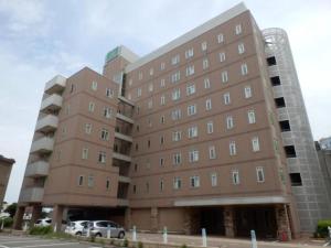 a large building with cars parked in front of it at R&B Hotel Kanazawa Station Nishiguchi - Vacation STAY 14972v in Kanazawa
