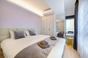 Cama ou camas em um quarto em NC Square Shinjuku -All Suite Residence-