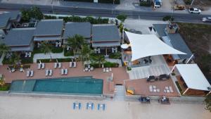 an aerial view of a house with a swimming pool at Prana Resort Nandana in Bangrak Beach