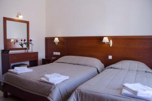 Postel nebo postele na pokoji v ubytování Hotel El Greco