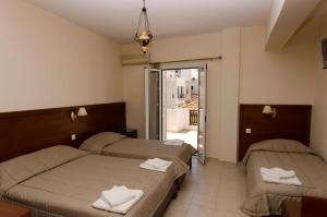 Postel nebo postele na pokoji v ubytování Hotel El Greco