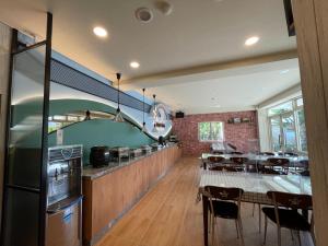 a kitchen and dining room with a table and chairs at Star Villa in Ren'ai