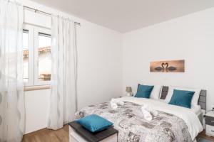 Postel nebo postele na pokoji v ubytování Apartman Palada