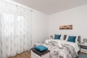Postel nebo postele na pokoji v ubytování Apartman Palada