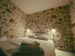 Postel nebo postele na pokoji v ubytování Lemons&Olives Rooms