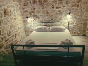 Postel nebo postele na pokoji v ubytování Lemons&Olives Rooms