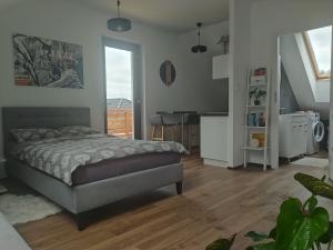 Postel nebo postele na pokoji v ubytování Apartament Muzyczny