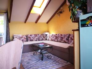 a living room with a couch and a table at Kuca Tonci & Semsa in Tisno