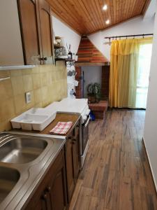 a kitchen with a sink and a counter top at Apartment Kika in Ližnjan