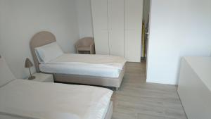 Postel nebo postele na pokoji v ubytování Lakecomoweb Apartments