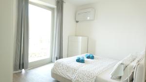 Postel nebo postele na pokoji v ubytování Lakecomoweb Apartments