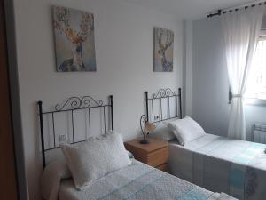 Postel nebo postele na pokoji v ubytování Piso Montesol + 7 fotografií