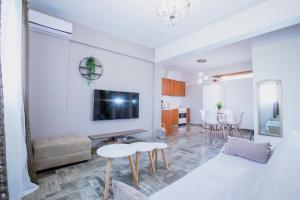a living room with a couch and a table at La Pietra Verga in Kalamata