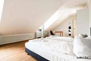 Postel nebo postele na pokoji v ubytování Hotel Blutenburg