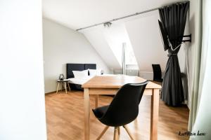 Postel nebo postele na pokoji v ubytování Hotel Blutenburg
