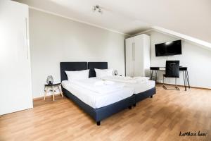 Postel nebo postele na pokoji v ubytování Hotel Blutenburg