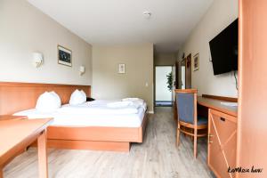 TV a/nebo společenská místnost v ubytování Hotel Blutenburg