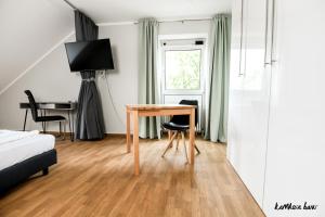 TV a/nebo společenská místnost v ubytování Hotel Blutenburg