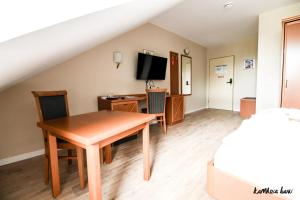 TV a/nebo společenská místnost v ubytování Hotel Blutenburg