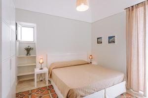 Letto o letti in una camera di Lamare cucina e dimore