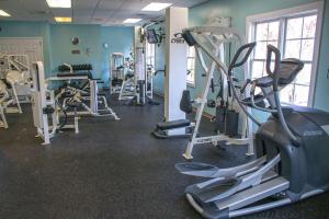 a gym with several tread machines in a room at Kings Creek Plantation by Tripforth in Williamsburg