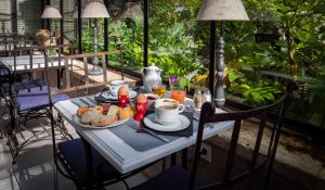 a table with a plate of food on top at La Maison Douce in Saint-Martin-de-Ré