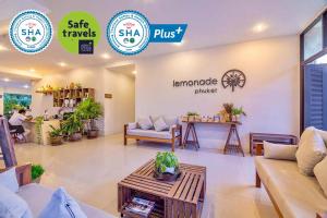 a store with couches and a table in a room at Lemonade Phuket Hotel -SHA Plus in Chalong