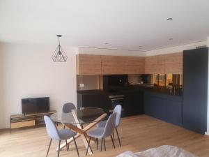 Kuchyň nebo kuchyňský kout v ubytování Le Vieux Chalet