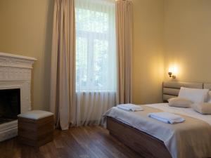 A bed or beds in a room at Boutique Hotel Filosofia