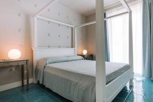 Letto o letti in una camera di Lamare cucina e dimore