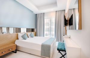 Postel nebo postele na pokoji v ubytování Dosinia Luxury Resort-Ultra All Inclusive