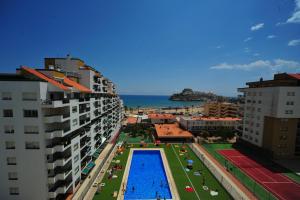 an aerial view of a city with a swimming pool at Peñiscola Playa Orangecosta in Peniscola