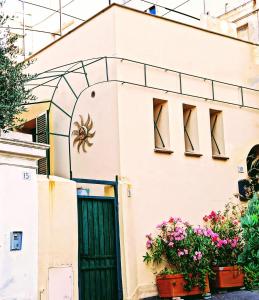 a house with a spider on the door at Sleep To The Sound Of The Surf in Ospedaletti