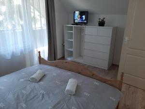 Postel nebo postele na pokoji v ubytování Nikolett apartman