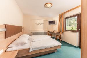 Postel nebo postele na pokoji v ubytování Hotel Starchlhof