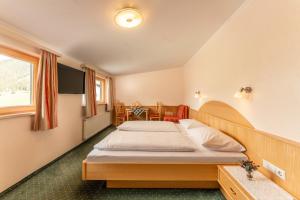 Postel nebo postele na pokoji v ubytování Hotel Starchlhof