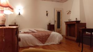Postel nebo postele na pokoji v ubytování Gîte La Lisière, en Brocéliande