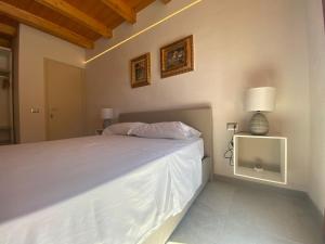 Postel nebo postele na pokoji v ubytování B&B Pettirosso