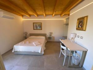 Postel nebo postele na pokoji v ubytování B&B Pettirosso