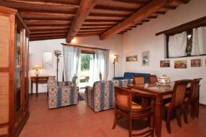 a living room with a table and a couch at Casa Citille in Greve in Chianti